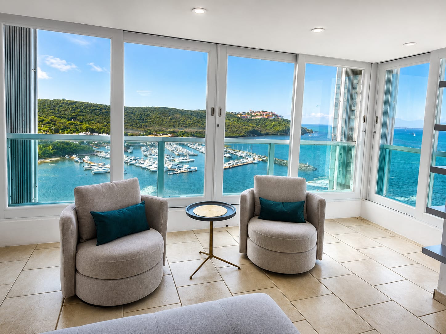 Corner sitting area with panoramic marina and ocean views